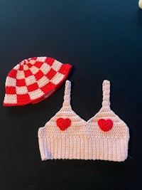 a crocheted bikini and hat on a table