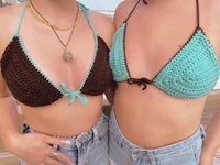 two women are posing in a crocheted bikini