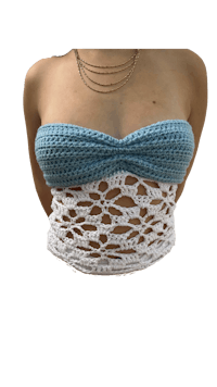 a woman wearing a blue and white crocheted top