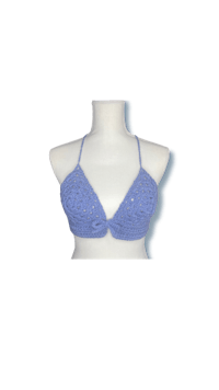 a blue crocheted bikini top on a mannequin