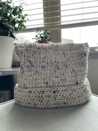 a crocheted bag sitting on top of a table